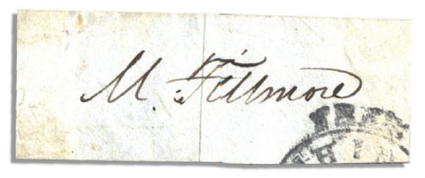 Millard Fillmore Signed Slip -- ''M. Fillmore'' in Black Ink -- 3'' x 1'' -- Stamp Mark to Lower Right -- Mounting Remnants to Verso -- Very Good