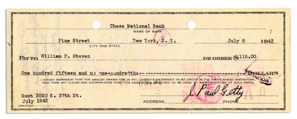 Billionaire ''J. Paul Getty'' Signed Check -- His $115 Check for the Rent at 2020 E. 37th St. in Oklahoma in July of 1942 -- Measures 8.25'' x 3.25'' -- Bank Cancellations & Crease, Else Near Fine