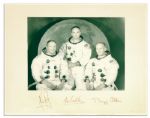 Signatures of Neil Armstrong, Michael Collins and Buzz Aldrin -- Surrounding a Portrait of the Apollo 11 Crew