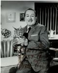 Walt Disney 7.25 x 9 Signed Photo Where He Holds a Baby Lynx