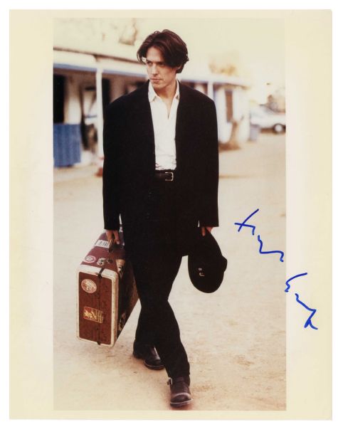 Hugh Grant Signed Photo -- 8'' x 10'' Glossy Signed in Blue Ink -- Near Fine Condition -- With Wehrmann COA