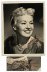 Betty Grable Signed Photo -- 8 x 10 Semi-Matte -- In Red: For Evelyn / Sincere Best Wishes / Betty Grable -- Very Good Condition