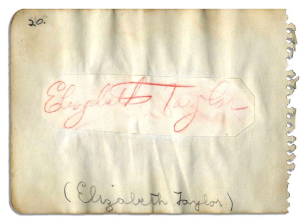 Elizabeth Taylor Signature in Orange Pencil -- 4.5'' x 1.25'' Slip Mounted to Album Page -- Slightly Faded, Else Very Good