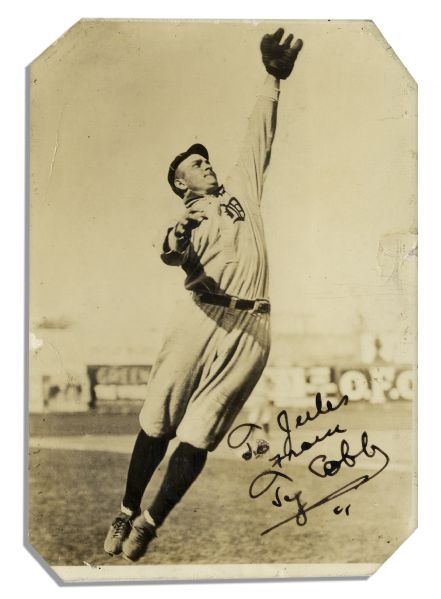 Excellent Ty Cobb Signed Photo of a Fielding Action Shot in Uniform -- With PSA/DNA COA