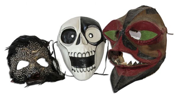 Ray Bradbury Personally Owned Trio of Masks -- One Signed by Artist Robert Beech -- Black & White Skull Mask, Feather Mask & Painted Fabric Mask -- 9'' x 10'' x 13'' -- With COA From Estate