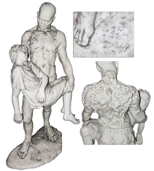 Ray Bradbury Owned Ceramic Statue of Man Cradling a Boy -- Likely Relating to One of His Stories -- Signed by Various People Along Base -- ''For Ray'' -- 19'' x 36'' -- COA From Estate