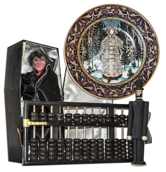 Ray Bradbury Owned Lot of Collectibles -- Heinrich Snow Maiden 8'' Plate, Wooden Abacus, Wooden Abe Lincoln Doll & Vampire Doll Inside a 6.5'' x 14'' x 3.5'' Coffin -- With COA From Estate