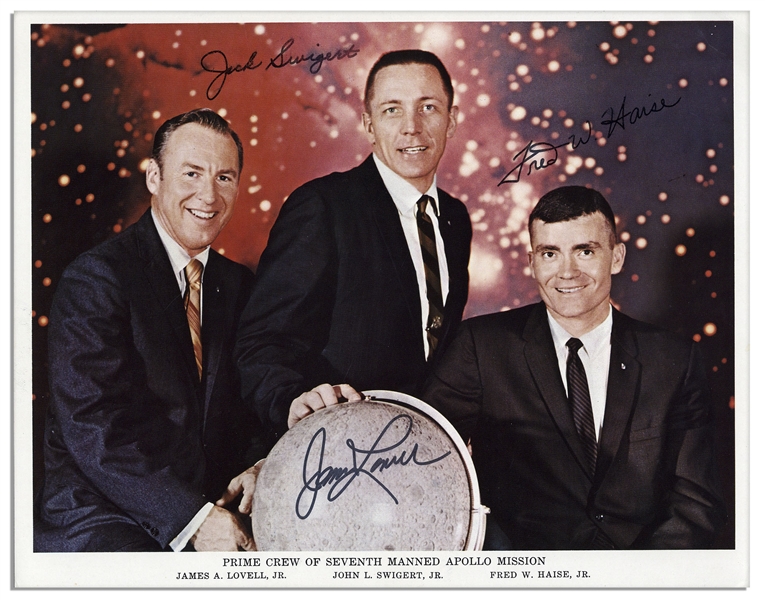 Pair of James Lovell 8'' x 10'' Photos Signed -- One Photo of Lovell in His Spacesuit & One Crew Photo of the Apollo 7 Astronauts in Civilian Suits