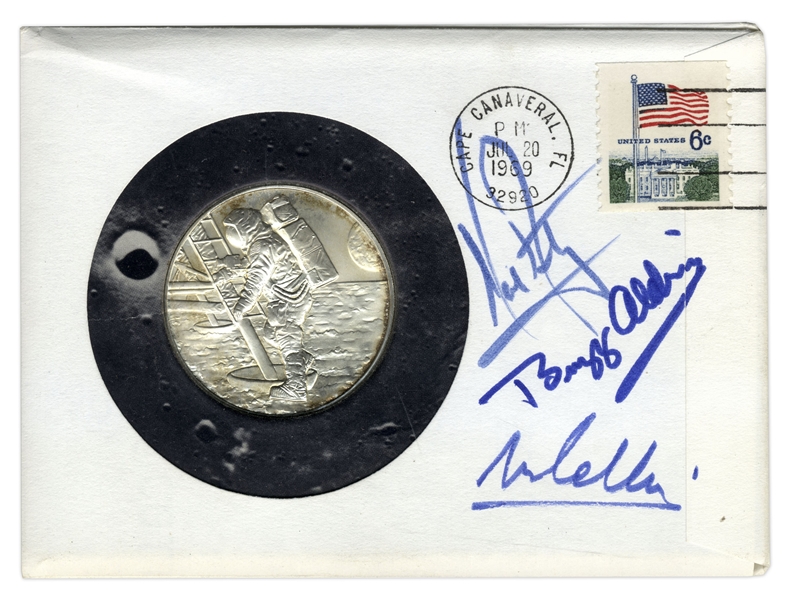 Apollo 11 Cover Signed by Neil Armstrong, Buzz Aldrin & Michael Collins -- With ''Man on the Moon'' Silver Medal & With COA From Steve Zarelli