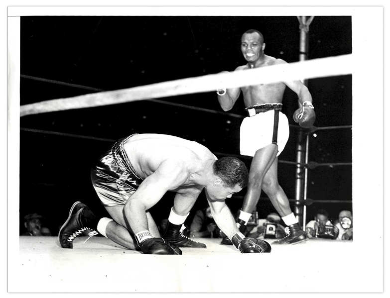 1948 Press Photo of the Joe Louis vs. Joe Walcott Fight -- 9'' x 7'' Glossy Shows Champ Louis on the Ground in 3rd Round -- Very Good Condition