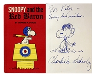 Charles Schulz Signed Drawing of Snoopy as the Flying Ace -- Within a First Edition of Snoopy and the Red Baron