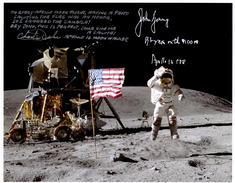 John Young and Charlie Duke Signed 10'' x 8'' Lunar Photo of Young Saluting the U.S. Flag During the Apollo 16 Mission -- Duke Additionally Writes, ''Hey John...Come give me a salute!''