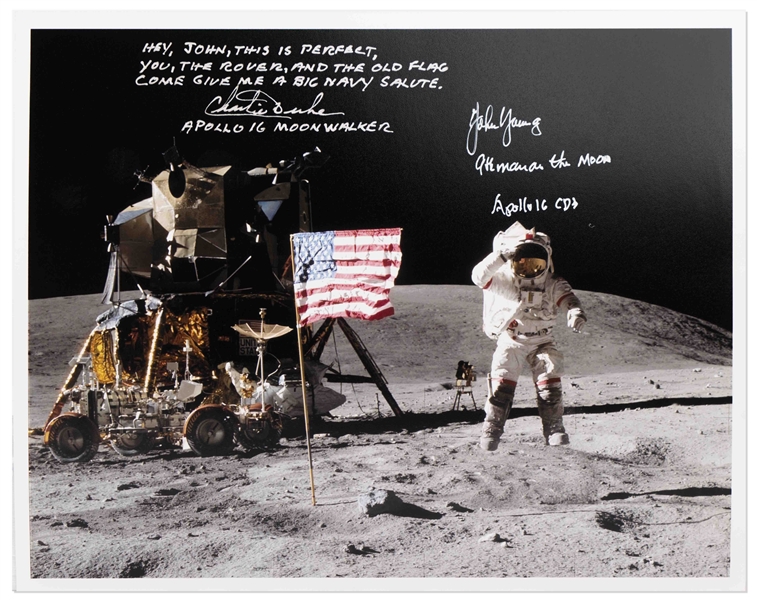 John Young and Charlie Duke Signed 10'' x 8'' Lunar Photo of Young Saluting the U.S. Flag During the Apollo 16 Mission -- Duke Additionally Writes, ''Hey John...Come give me a big Navy salute''