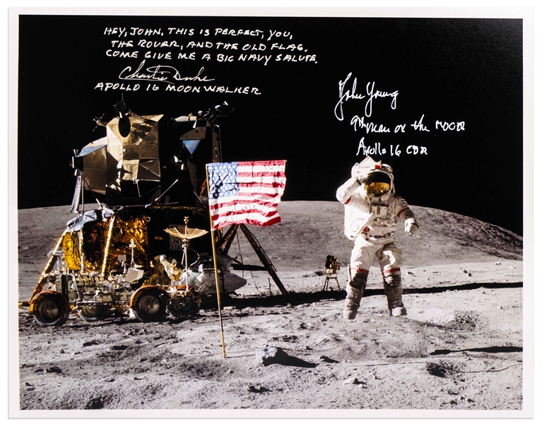 John Young and Charlie Duke Signed 10'' x 8'' Lunar Photo of Young Saluting the U.S. Flag During the Apollo 16 Mission -- Duke Additionally Writes, ''Hey, John...Come give me a big Navy salute''