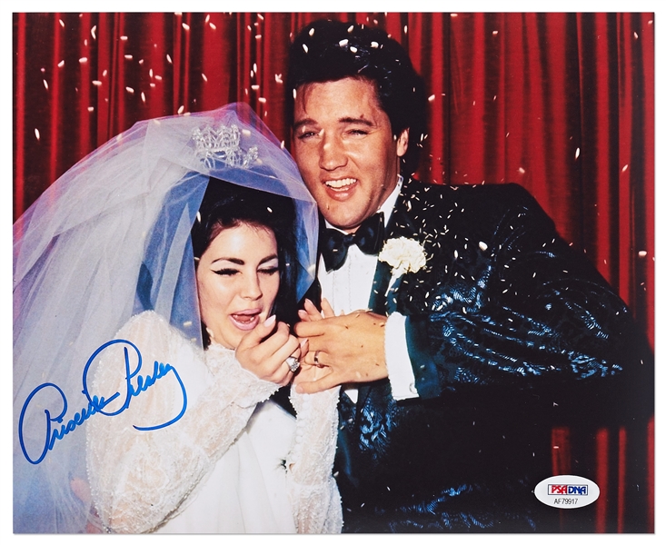 Priscilla Presley Signed 10 x 8 Photo -- Showing Her & Elvis on Their Wedding Day, Being Pummeled With Rice -- With PSA/DNA COA