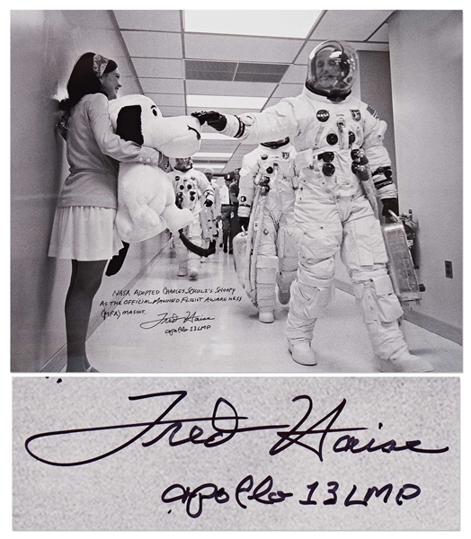 Fred Haise Signed 20'' x 16'' Photo of Apollo 10 Commander Tom Stafford Tapping Snoopy's Nose Before the Mission -- Haise Writes: ''NASA adopted Charles Schulz's Snoopy as the official...mascot''
