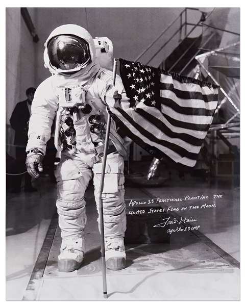 Gorgeous 20'' x 16'' Photo of James Lovell in His White Spacesuit with the U.S. Flag -- Signed by Apollo 13 LMP Fred Haise