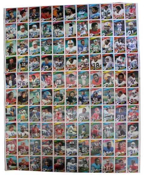Three Uncut Sheets of 1984 Topps Football Cards -- All 132 Cards Present -- Rookies Include Steve Young, Herschel Walker, Jim Kelly, Anthony Carter, Kelvin Bryant, Mike Rozier and Reggie White