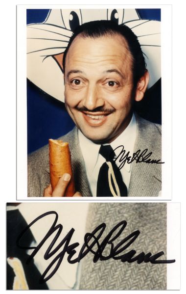 Photo Signed ''Mel Blanc'' in Black Marker to Lower Right Corner -- Measures 7.5'' x 10'' -- Blanc Poses With a Carrot In Front of a Bugs Bunny Image -- Excellent Condition
