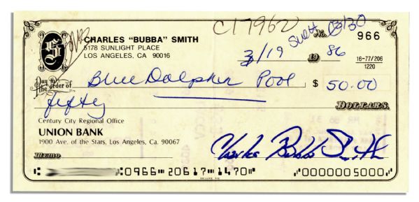 Check Signed ''Charles Bubba Smith'' in Blue Marker -- 19 March 1986 -- Measures 6'' x 2.75'' -- Cancellation Stamps to Verso; Very Good