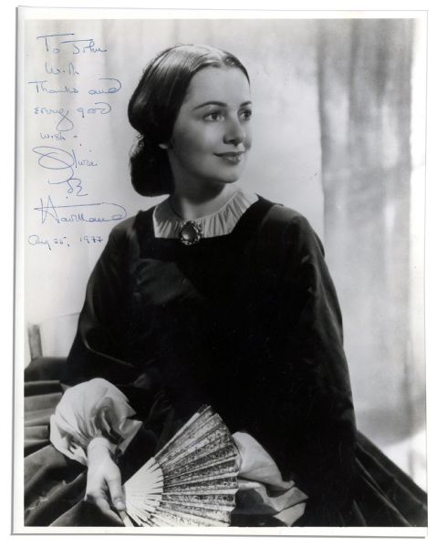 Olivia de Havilland Signed 7.75'' x 10'' Glossy Photo -- ''To John With Thanks and every good wish - Olivia de Havilland / Aug 25, 1977'' -- Creasing & Notations to Verso Else Near Fine