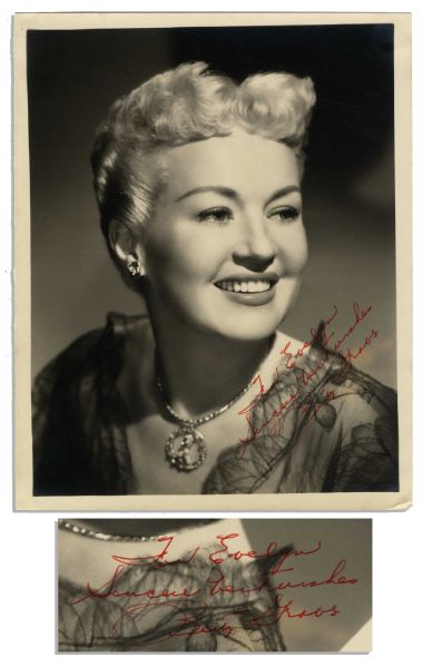 Betty Grable Signed Photo -- 8'' x 10'' Semi-Matte -- In Red: ''For Evelyn / Sincere Best Wishes / Betty Grable'' -- Very Good Condition