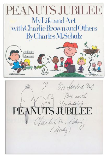 Charles Schulz Hand Drawing of Snoopy Showing His Heart -- Drawn and Signed Within His ''Peanuts Jubilee'' Book