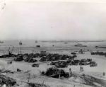 Original World War II 10 x 8 Black and White Glossy Press Photo -- Cargo Trucks on Normandy Beachhead -- Very Good