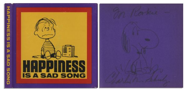 Charles Schulz Hand-Drawn Sketch of Snoopy, Within His Signed ''Peanuts'' Book, ''Happiness is a Sad Song''