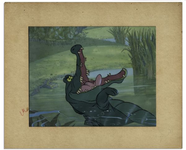 Ray Bradbury Owned Disney Cel From ''David & Goliath II'' -- Hand-Painted Crocodile ''Tick Tock'' -- With Disney Sticker -- Matted to 14'' x 12'' -- Near Fine -- COA From Estate