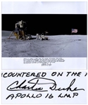 Charlie Duke Signed 20 x 16 Photo of the U.S. Flag Raised on the Lunar Surface -- With a Handwritten Inscription About the Mission: ...Apollo 16 spent more than 20 hours exploring the moon...