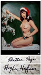 Hugh Hefner and Bettie Page Signed Limited Edition of Pages Famous Christmas Photo -- With Beckett COA