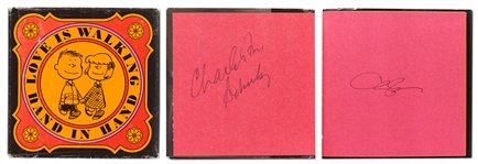 Charles Schulz Signed Peanuts Book, Love Is Walking Hand in Hand