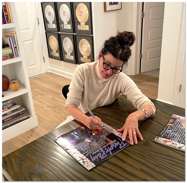 'Purple Rain'' Designer, Laura LiPuma, Signed Statement on the LP Cover -- ''We picked the purple he wanted to use (PMS272) and he said he wanted a different font for each song title on the back...''