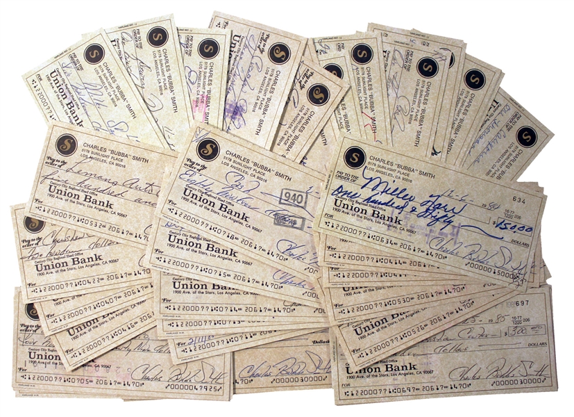 Lot of 50 Checks Signed by Charles ''Bubba'' Smith -- All Signed With His Name & Nickname, ''Charles Bubba Smith'' & Some Made Out in Smith's Hand -- Very Good Condition