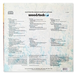 Woodstock Album Signed by Photographer Burk Uzzle & the Iconic Couple -- ''...Someone with a guitar here, someone making love there, someone smoking a joint...a bombardment of the senses...''
