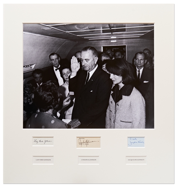 Signed 25.25'' x 27'' Photo Display of Lyndon B. Johnson Taking the Oath of Office Aboard AF1, Next to a Grieving Jackie Kennedy -- Signed by Jackie and Lyndon & Lady Bird Johnson, With PSA/DNA COAs