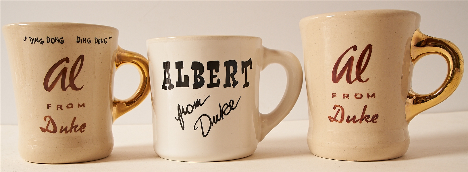 Lot of Three John Wayne Mugs for ''The Alamo'', ''The Shootist'' and ''The Horse Soldiers'' -- Wayne's Famous Mugs Were Gifted to the Cast and Crew of His Films