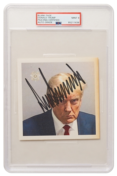 Donald Trump Signed Mug Shot -- Encapsulated by PSA/DNA with Autograph Graded 9